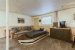 Whimsical boat style bed gives this space fun beach vibes